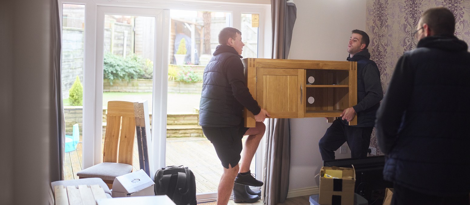 Removal company helping a family move out of their old home